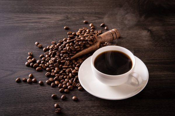 Coffee,Beans,And,Hot,Coffee,On,The,Table